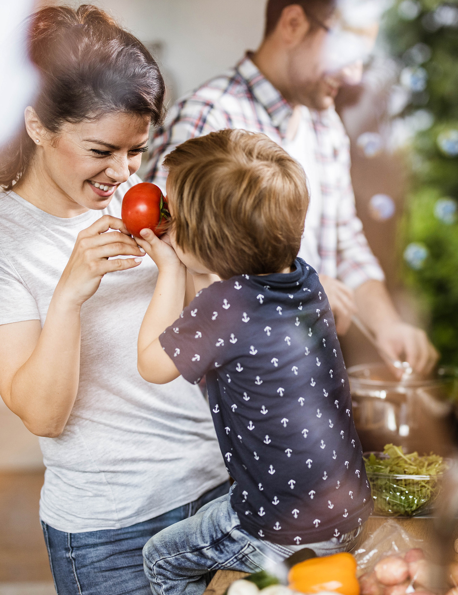 Mother and son cooking with produce